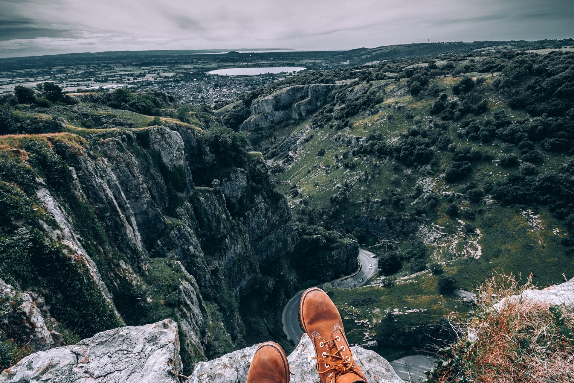 boots-sat-on-top-of-rock-above-winding-road-cheddar-gorge-somerset-day-trips-from-bristol