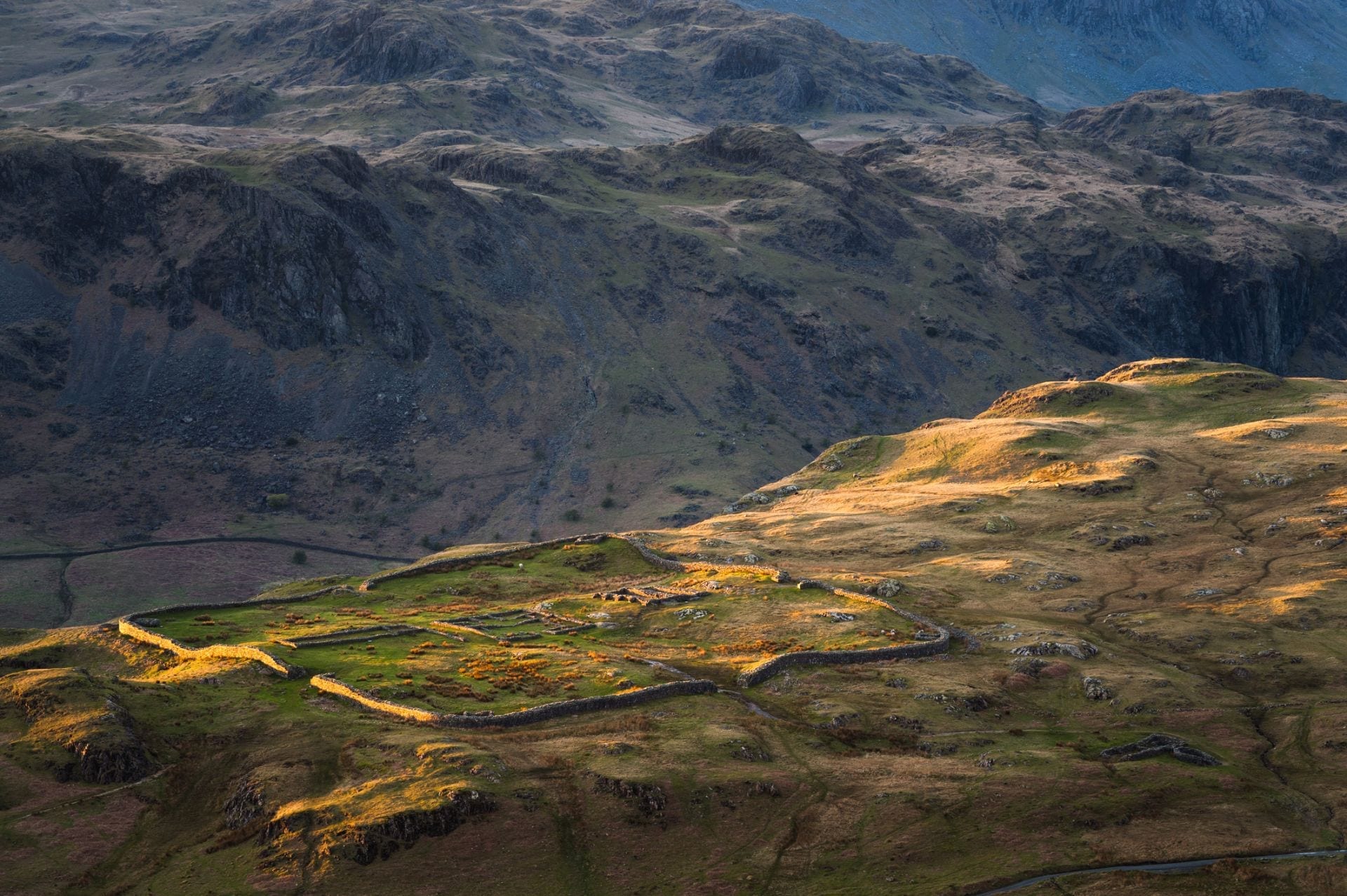 hardknott-pass-road-in-lake-district-england-surrounded-by-mountains