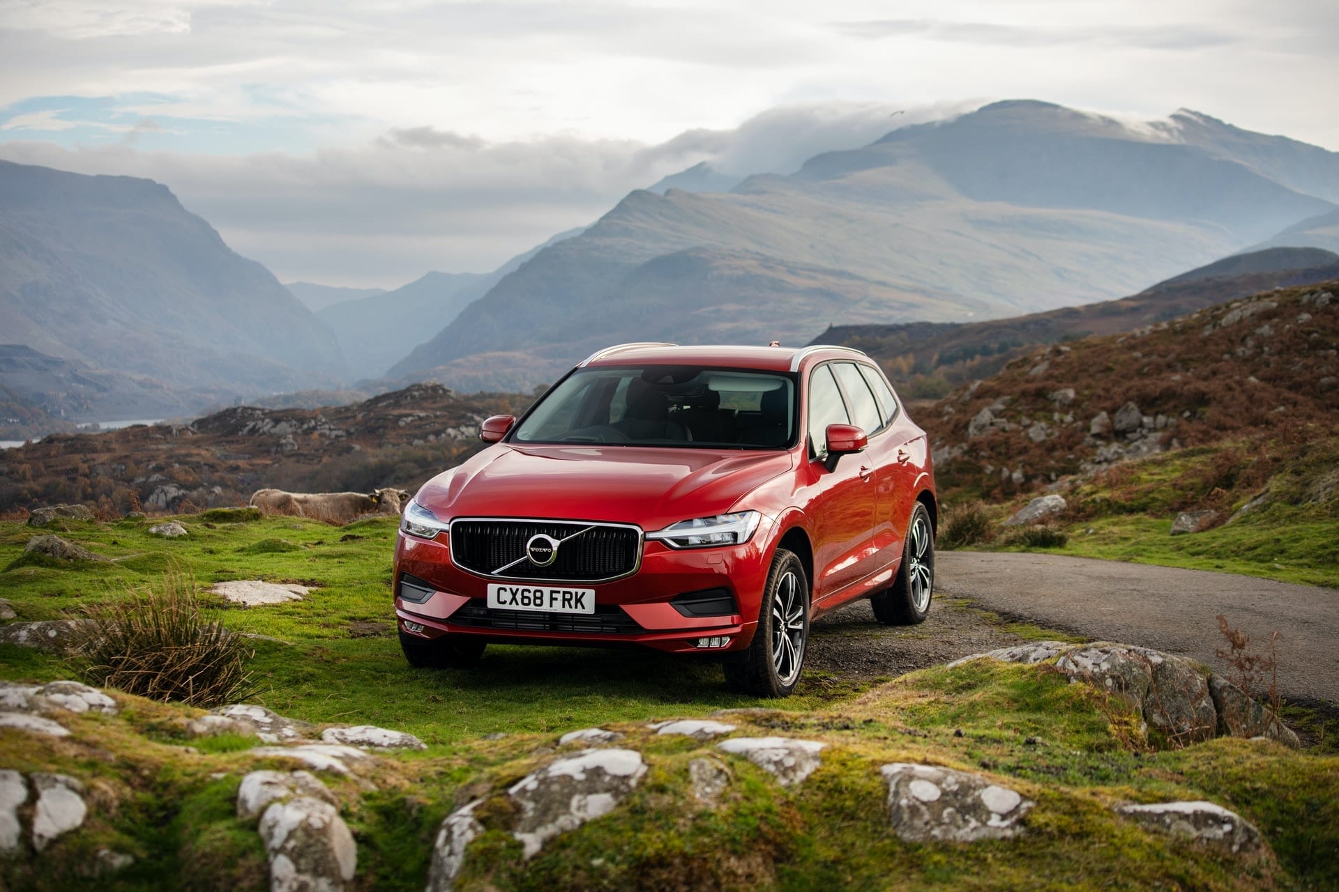 red-volvo-pulled-up-to-side-of-road-in-the-mountains-brecon-beacons-snowdonia-wales-best-scenic-drives-in-uk