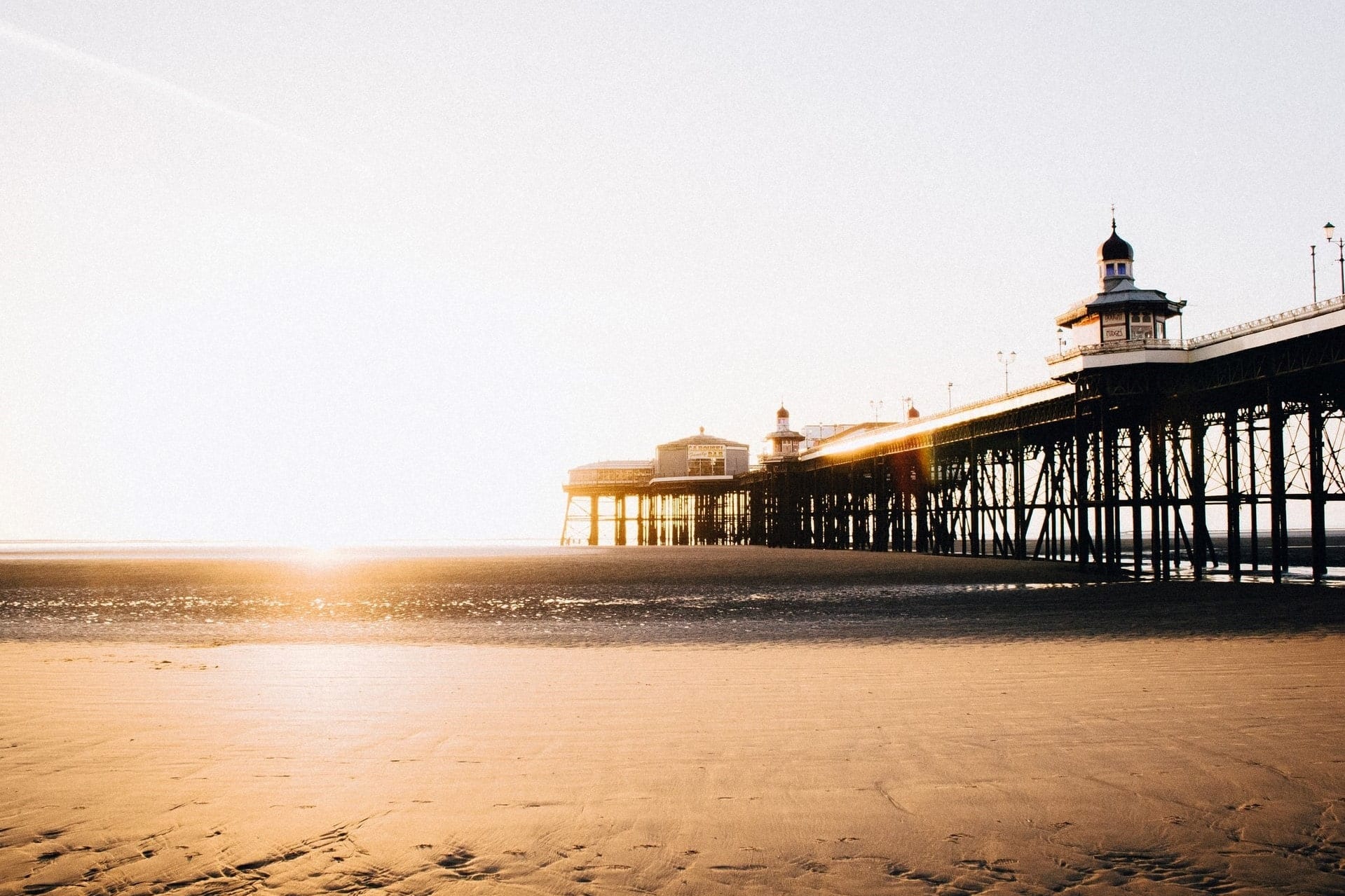 sandy-beach-and-pier-at-sunset-in-blackpool-day-trips-from-manchester